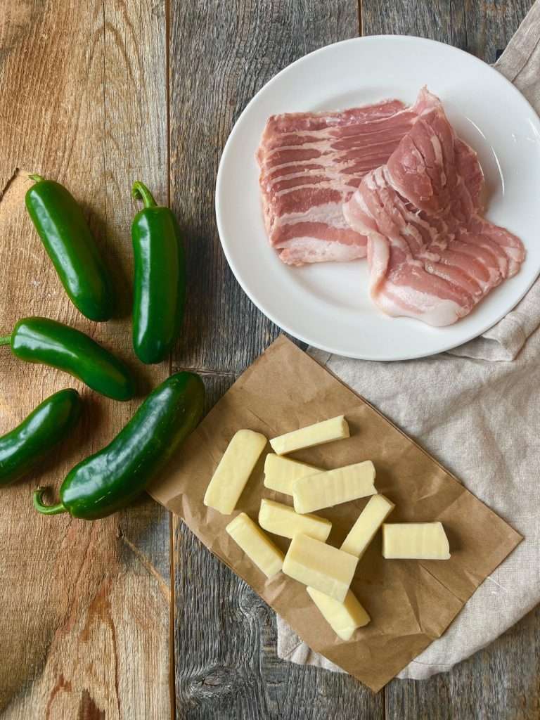 Bacon-Wrapped Stuffed Jalapeno Poppers Just Crumbs by Suzie Durigon