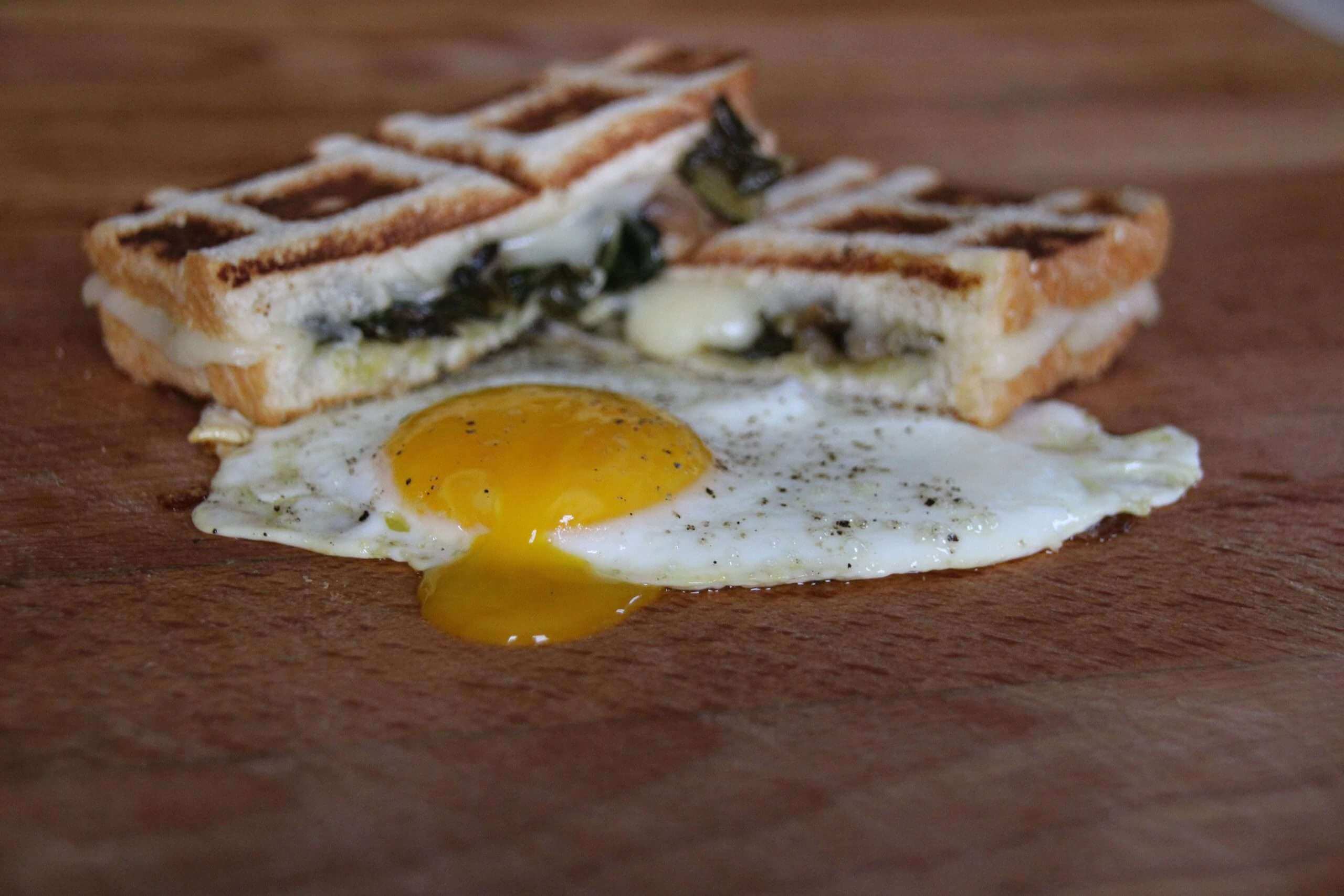 Brioche Grilled Cheese with Braised Dandelion and Farm Eggs