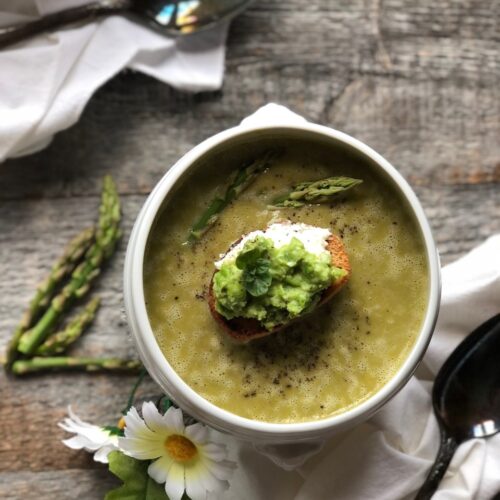 Fresh asparagus and pea soup with ricotta and smashed pea and mint crostini