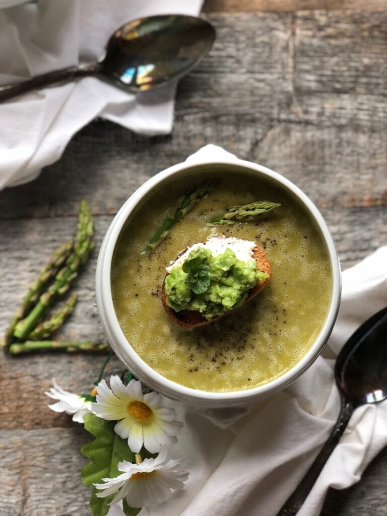 Fresh asparagus and pea soup with ricotta and smashed pea and mint crostini